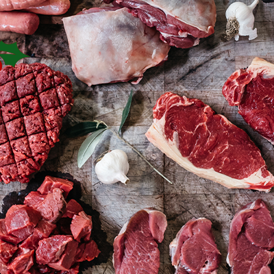Overview shot of various cuts of meat like steaks, mince and fillet.