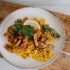 Waipawa Butchery Kitchen Singapore Chicken and Rice on a white plate, sitting on a chopping board.